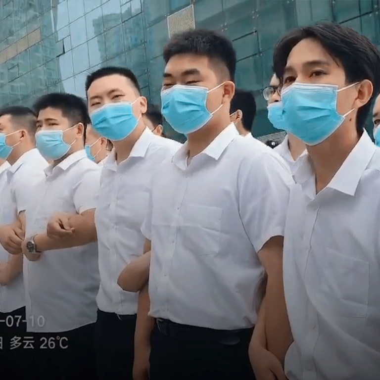 Victims of one of China’s worst financial scandals attacked by unidentified men in white at protest